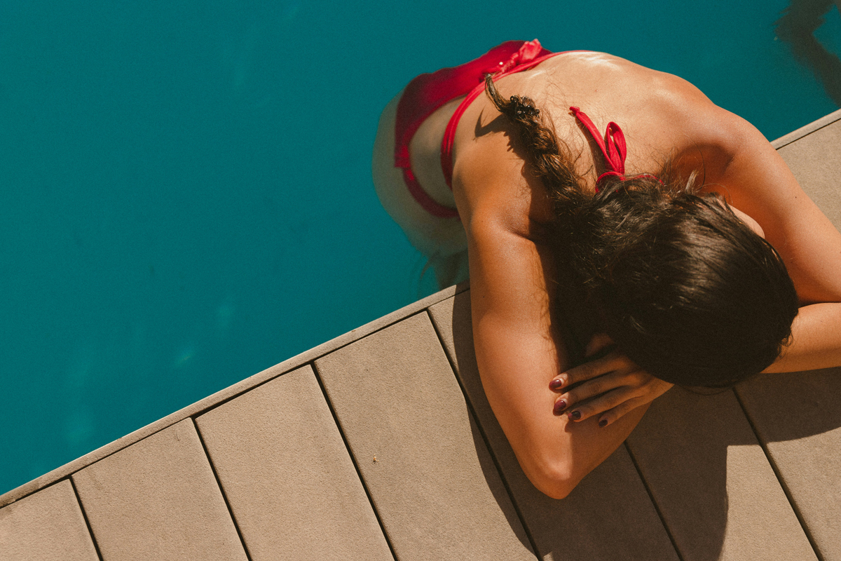Person relaxing in a swimming pool
