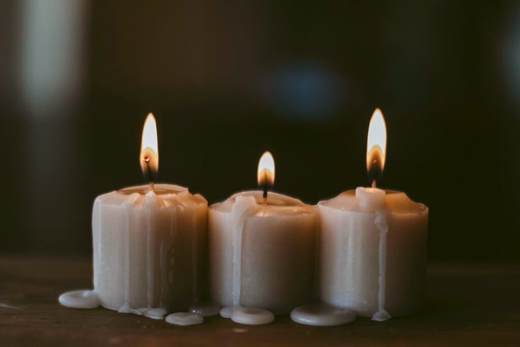 Three lit candles