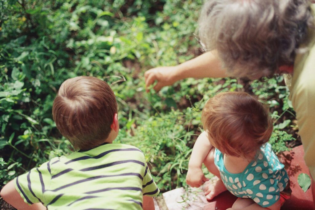 Grandparent outside with grandchildren