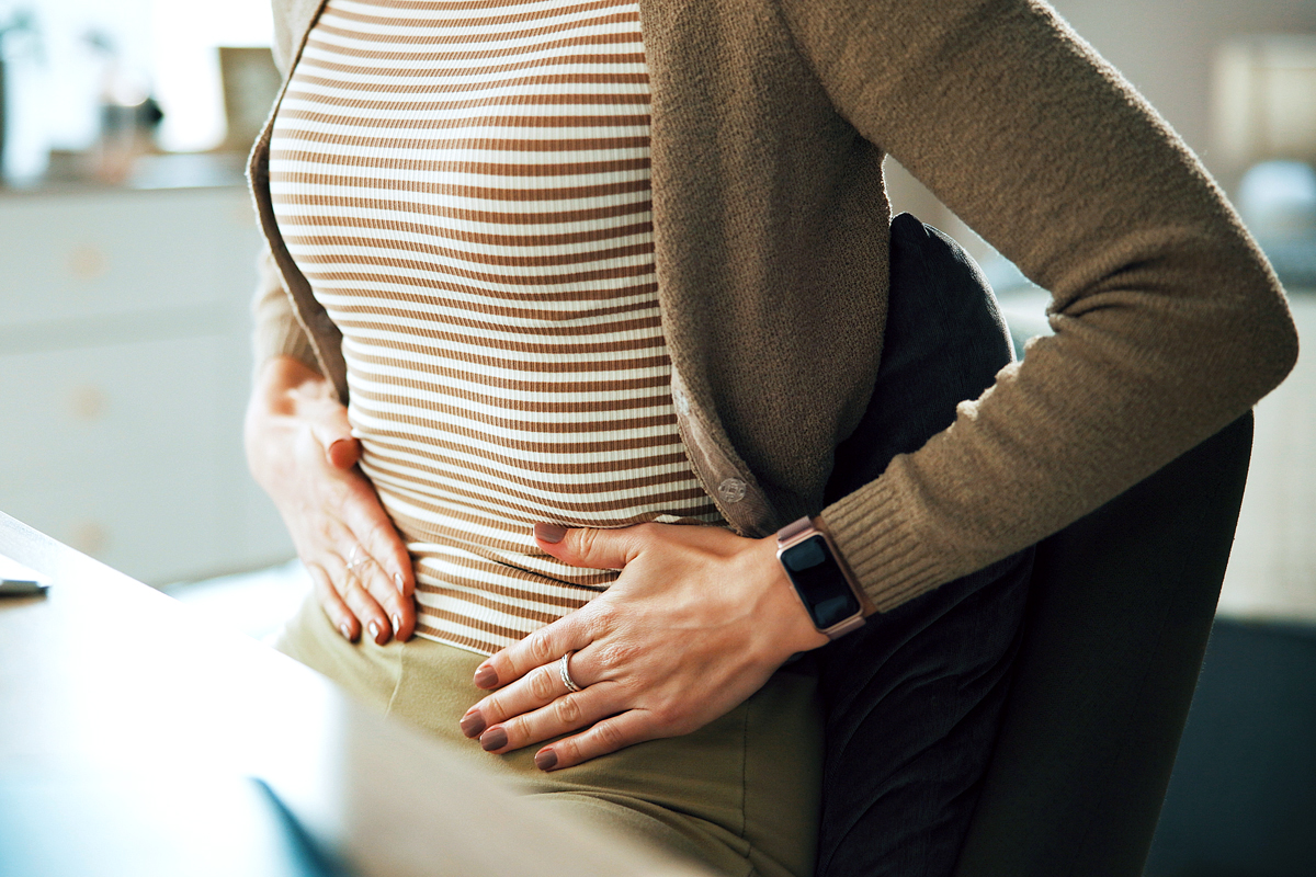 Person holding their stomach
