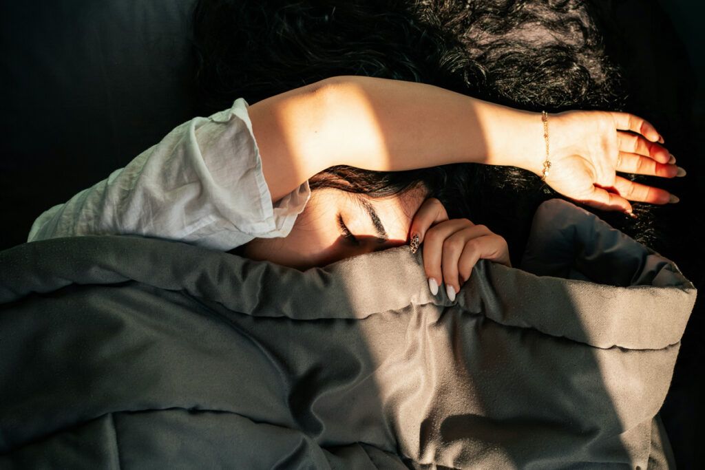 Person sleeping in sunlight