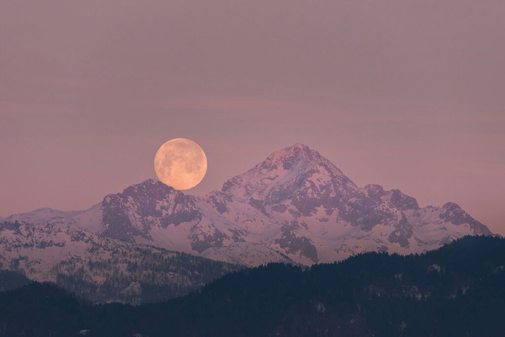 Moon behind a mountain