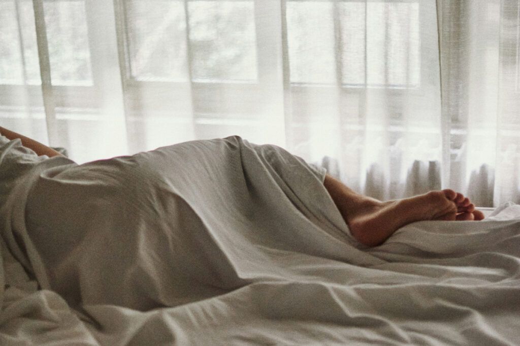 Person sleeping in bed