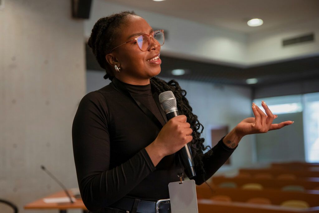Person speaking into a microphone