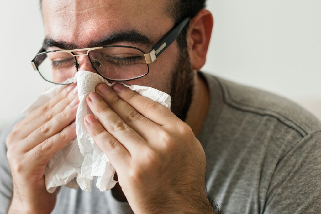 Person blowing their nose