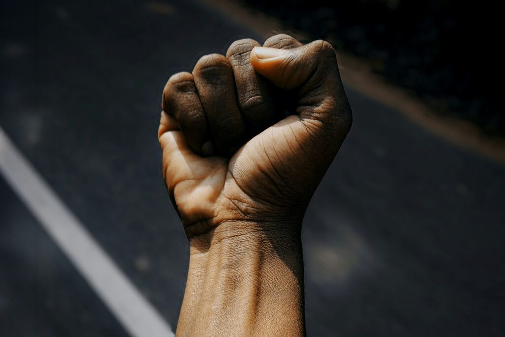 Clenched fist with palm facing