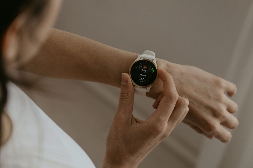 Person checking their heart rate on smartwatch