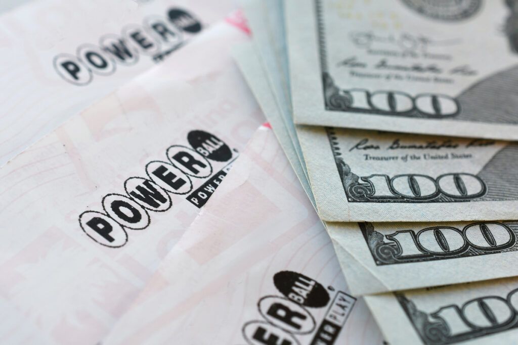 Powerball tickets and $100 bills