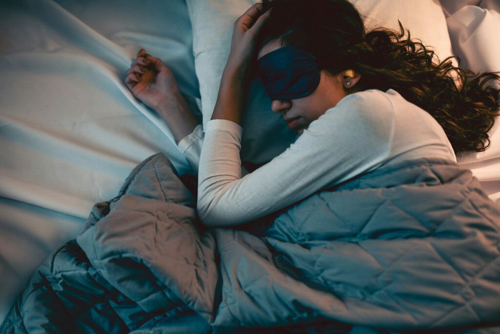 Person sleeping with eye mask